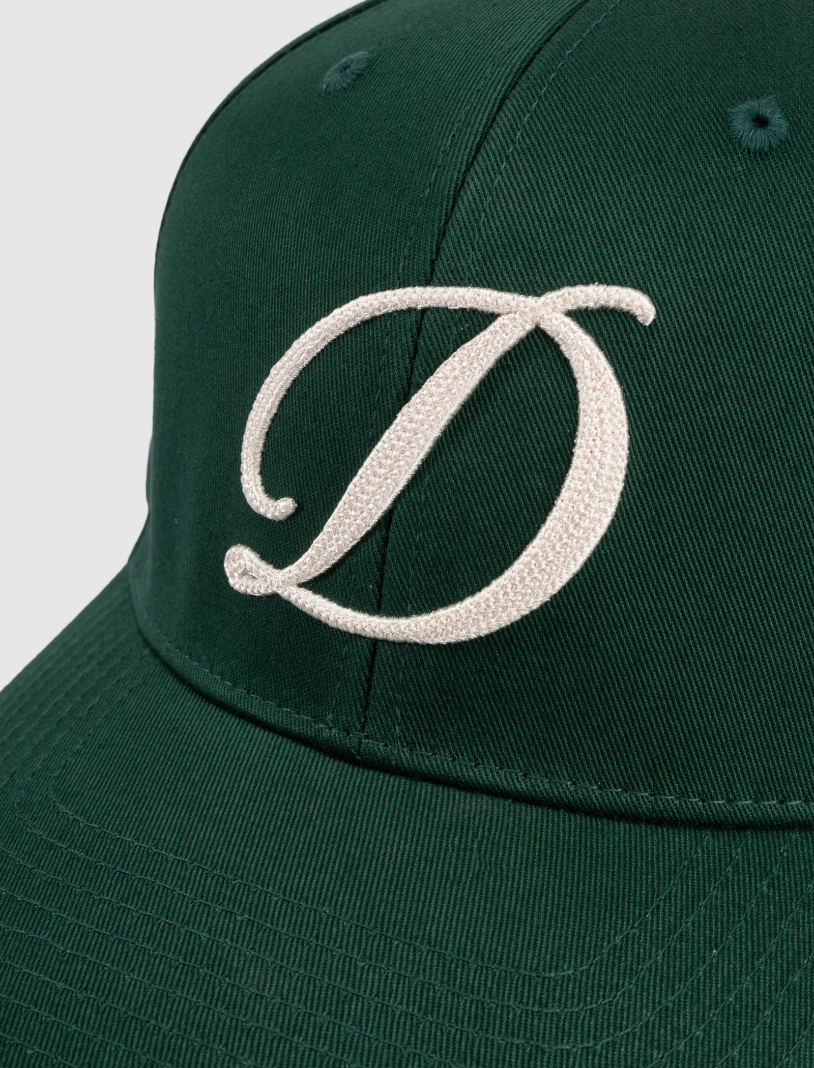 CURSIVE D CAP