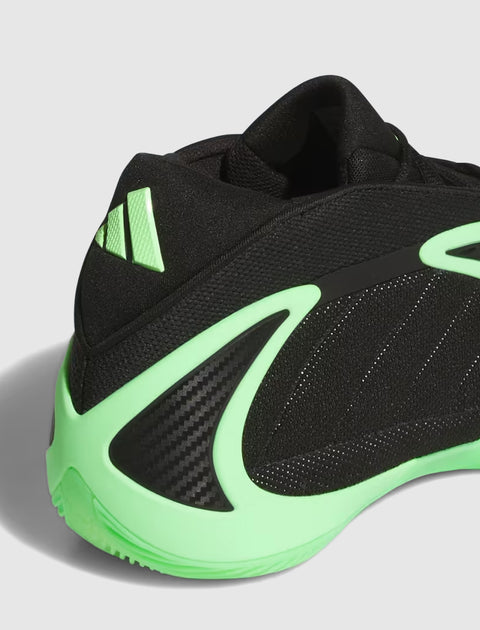 Black and neon green sneaker with mesh upper, carbon fiber detail, and sporty design