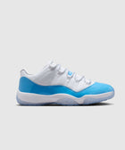 White and blue low-top sneaker with patent leather accents on a neutral background