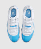Pair of white and blue low-top sneakers with patent leather and Nike Air logo on insoles