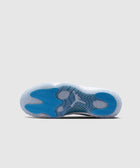 Blue and white sneaker sole with translucent rubber and herringbone traction pattern