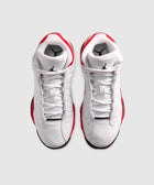 Pair of white and red high-top sneakers with black logo, top view on plain background
