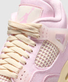 Closeup of pink and cream mesh sneaker with cream laces and pastel detailing