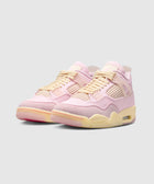 Pastel pink and cream suede sneakers with mesh panels and yellowed sole on light background