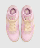Top view of pink and cream suede sneakers with mesh accents and lace-up closure