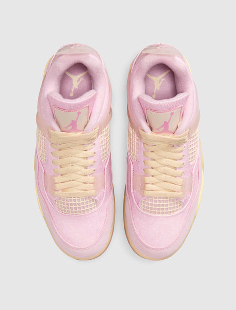 Top view of pink and cream suede sneakers with mesh accents and lace-up closure