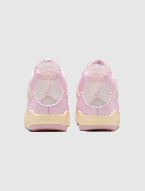 Rear view of pink and cream low-top sneakers with translucent heel tab and logo