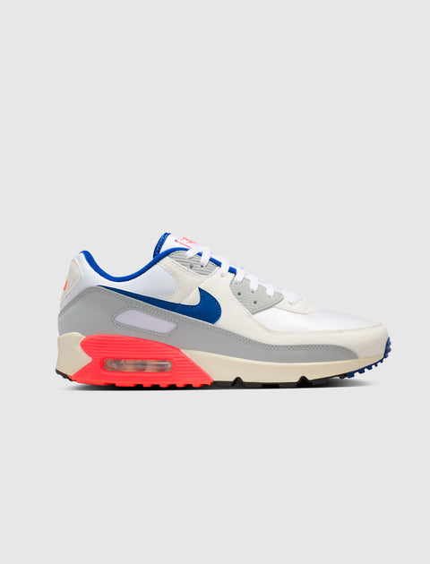 White, blue, and neon pink Air Max sneaker with visible air sole unit on white background