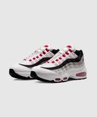 Men's white, grey, and red Air Max sneakers with visible air sole unit, streetwear style