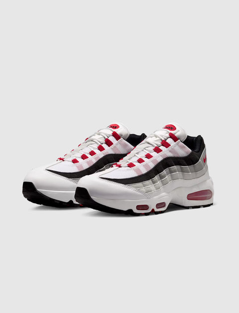 Men's white, grey, and red Air Max sneakers with visible air sole unit, streetwear style