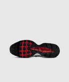 Black and red rubber sneaker sole with textured tread pattern on white background