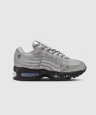 Silver mesh and leather sneaker with black sole, visible air bubble, side profile view