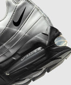 Close-up of silver and black Air Max 95 sneaker with visible air unit and Swoosh logo