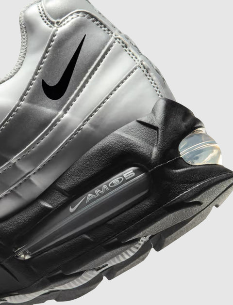 Close-up of silver and black Air Max 95 sneaker with visible air unit and Swoosh logo
