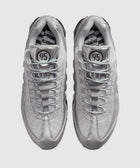 Top view of silver mesh and leather sneakers with '95' logo on tongue and patterned insoles