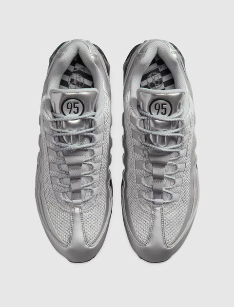 Top view of silver mesh and leather sneakers with '95' logo on tongue and patterned insoles