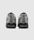 Back view of silver and black Air Max sneakers with visible air cushion soles on white background.
