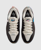 Top view of black and white men's sneakers with graphic tongue logos and contrast lace details