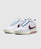 White basketball sneakers with blue and red accents, side view, rubber sole, lace-up style