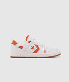 White and orange low-top sneaker with leather upper, side star detail, and gum sole on plain background