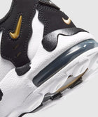 Close-up of black and white sneaker with gold accents and visible air-cushioned sole