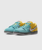 Pair of low-top sneakers with teal blue front, yellow back, and light grey swoosh on white background