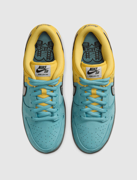 Top view of yellow and turquoise Nike SB Dunk Low Pro sneakers with black swoosh logo
