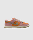 Low-top sneaker in pink, orange, and beige suede with olive green swoosh and laces