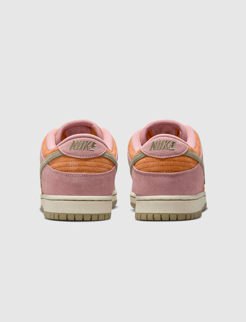 Back view of pink and orange Nike low-top sneakers with suede accents