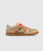 Beige and olive green low-top sneaker with red laces and textured panels on white background