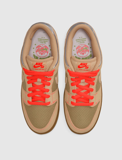 Top view of tan and olive green Nike SB Dunk Low sneakers with bright orange laces