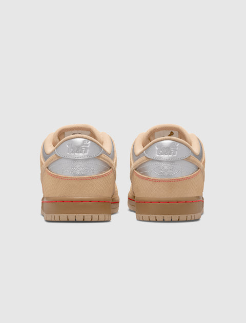 Beige and silver low top sneakers with textured uppers, viewed from the back
