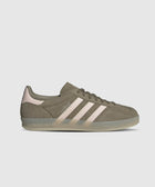 Olive green suede sneaker with pale pink stripes and translucent gum sole