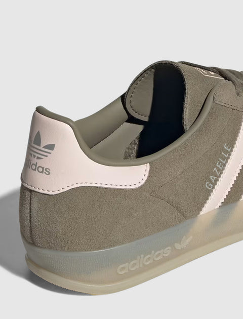 Close-up of suede Adidas Gazelle sneaker in muted pink and beige with translucent sole