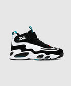Black and white athletic sneaker with number 24 and teal accents on gray background