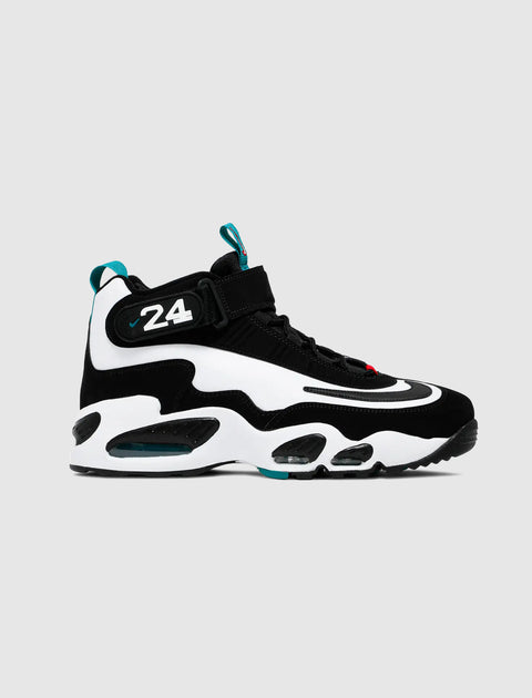 Black and white athletic sneaker with number 24 and teal accents on gray background