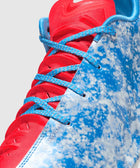 Close-up of blue and white speckled basketball sneaker with red tongue and blue laces
