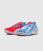 Pair of Nike sneakers with blue and red mismatched design on a white background