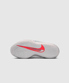 White basketball sneaker outsole with red Nike Swoosh and circular traction pattern