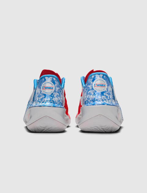 Rear view of blue, white, and red sneakers with WNBA 30th anniversary logo on heels
