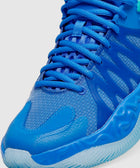 Close-up of blue athletic sneaker with mesh upper and textured rubber sole