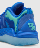 Close-up of blue athletic sneaker with teal accents and textured sole