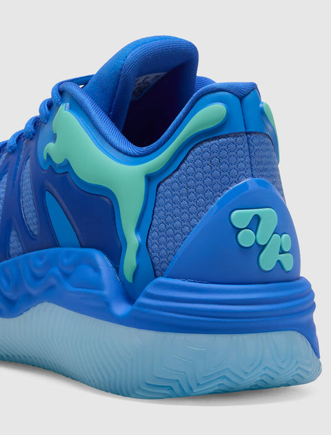 Close-up of blue athletic sneaker with teal accents and textured sole