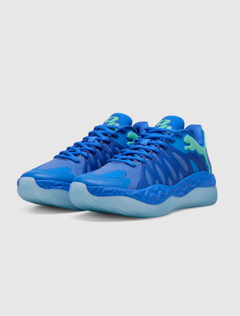 Men's bright blue athletic sneakers with textured soles and gradient green details