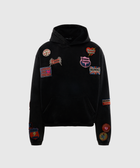 Black streetwear hoodie with colorful embroidered patches on front and sleeves