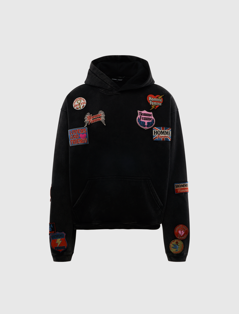 Black streetwear hoodie with colorful embroidered patches on front and sleeves