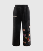 Black streetwear sweatpants with colorful embroidered patches and elastic waistband