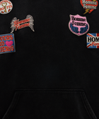 Black streetwear hoodie with colorful embroidered patches and front pocket
