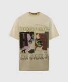 Beige graphic streetwear t-shirt with abstract face art and bold text designs on the front.