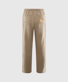 Beige streetwear pants with elastic waistband, back pockets, and yellow patch detail